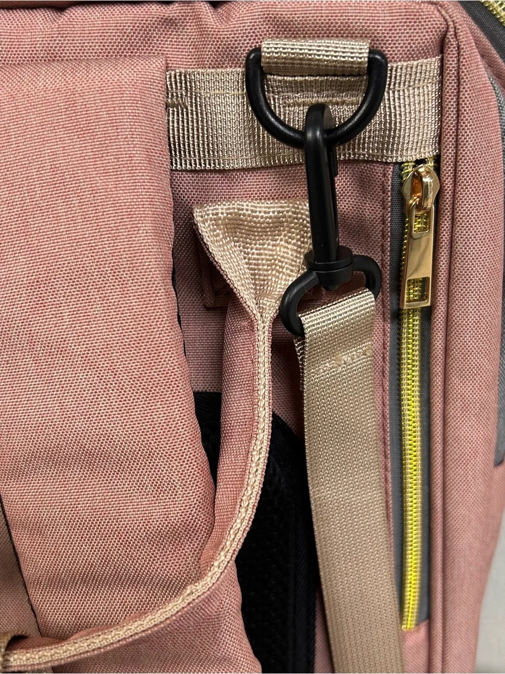 LAND Traveling Share diaper bag backpack in a pink and gray color scheme